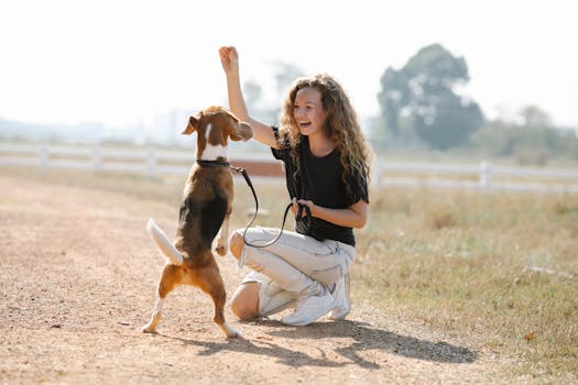 happy service dog with trainer